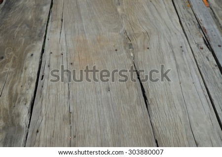 Old wooden floor damaged by time and insects