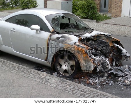 MAY 8, 2013 - BERLIN: a burned out Audi TT sports car in the Friedrichshain district of Berlin - vandalism acts like this have become a common sight in the German capital these days.