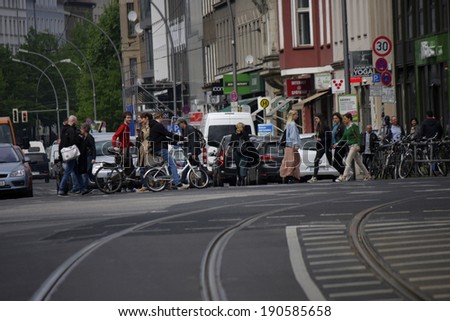 CIRCA MARCH 2014 - BERLIN: street scene: pedestrians at a crossing at the Rosenthaler Platz in the Mitte district of Berlin.