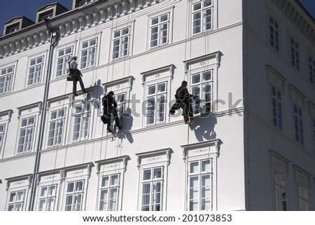 CIRCA APRIL 2009 - BERLIN: cat burglars at a house fassade for maintenance work in the Mitte district of Berlin.