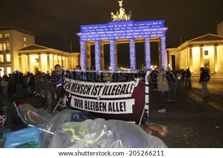 OCTOBER 18, 2013 - BERLIN: protests of asylum seekers, the illuminated Brandenburg Gate at the Pariser Platz in Berlin Mitte during the \
