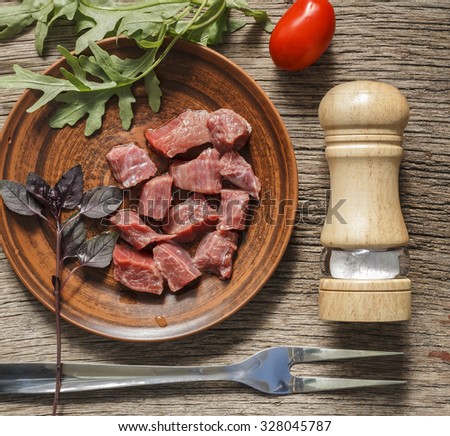 Meat and spices.Top view.Rustic style. Closeup. Square shot. Square image