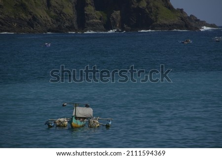 Small Boat in The Middle of The Sea