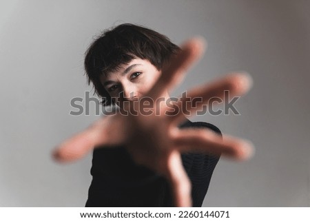 Similar – Image, Stock Photo A woman reaches for a product in a grocery store