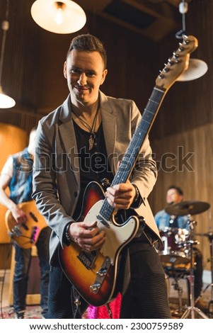 Similar – Foto Bild Ein junger Musiker singt im Regierungsviertel Berlin und zupft auf seiner Gitarre