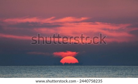 Image, Stock Photo The sun disappears behind the trees. Behind the house it is already dark. A strong cloud cover gives the whole a magnificent panorama.