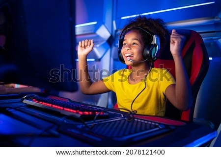 Similar – Image, Stock Photo Children playing video game in evening time