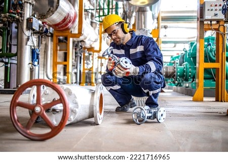 Similar – Foto Bild Arbeiter bei der Installation von Rohren mit Schraubenschlüssel in der Werkstatt