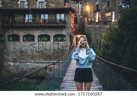 Similar – Image, Stock Photo Tourist on the bridge visiting the city of Bilbao, Spain