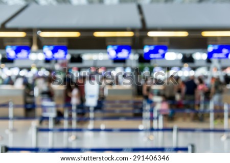 Abstract Blur Background : Airport Check-In Counters With Passengers And Crowd Control Barriers With Bokeh