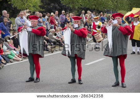 Tree trumpeters performing in a parade.Shot at a public event. Hanswijk cavalcade in Mechelen,2013.