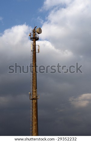 Microwave Tower isolated against a darkish sky