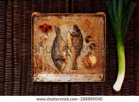 Chef cooked fresh fish restaurant Dorado garnish customers asked to submit to the fish grilled vegetables