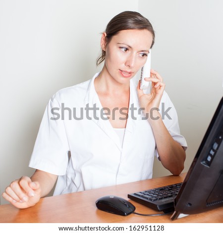 Medical receptionist making an appointment