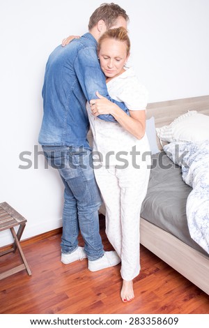 Older son helps mother to get out of bed