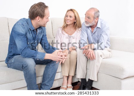 Elderly son talking with his parents