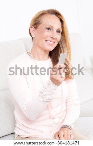 Elderly woman with a hearing aid