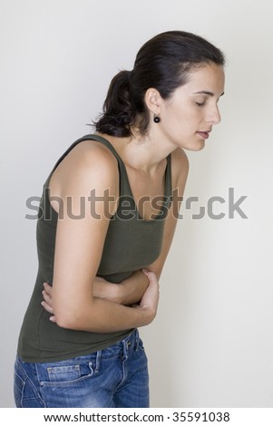 Young woman with stomachache isolated on white background