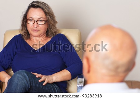 Middle aged woman talking to psychologist