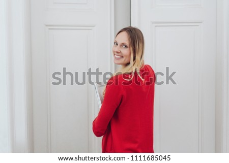 Similar – Image, Stock Photo A young woman leaving the airport with her luggage at her destination