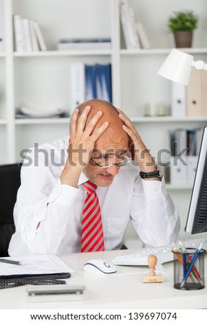 desperate businessman having problems with computer