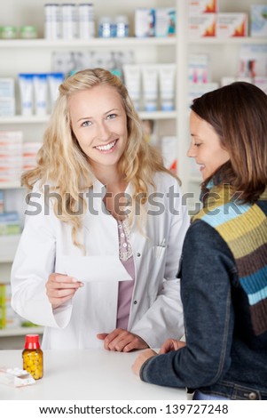 Customer with flu talking to pharmacist in pharmacy