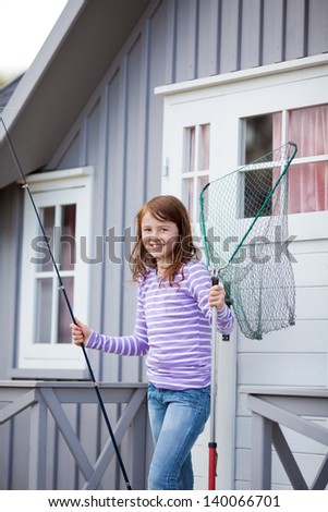 Girl Holding Fishing Net And Rod