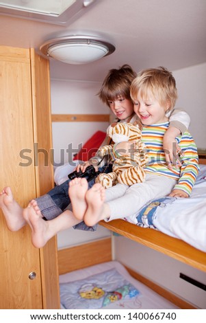 Two happy Boys In A Caravan