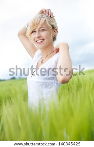 young beautiful woman with hand on head