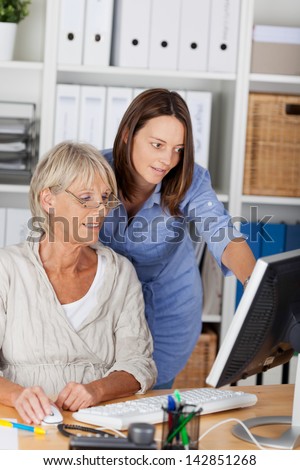 Women from different generations working together in an office.