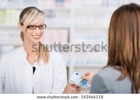 Patient pays for the medicine to a friendly female pharmacist with a twenty euro note