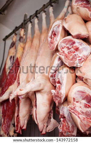 Pork meat hanging on trail at butcher\'s shop