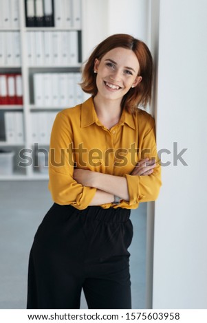 Similar – Image, Stock Photo Young woman leans against a board wall and looks into the camera
