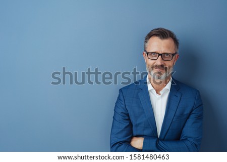 Similar – Image, Stock Photo Senior businessman in blue jacket using smartphone