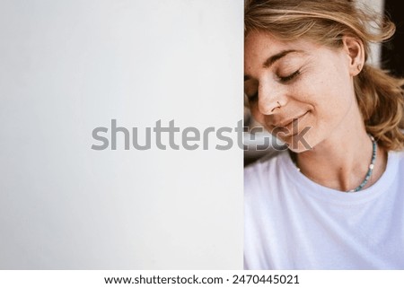 Similar – Image, Stock Photo thoughtful woman leaning on wall