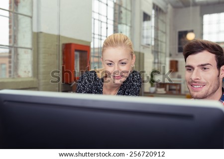 Close up Smiling Man and Woman Looking at Computer Screen.