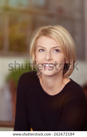 Close up Young Thoughtful Woman with Blond Hair Wering Plain Black Long Sleeve Shirt, Looking Up with a Smile