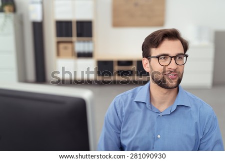 Close up Thoughtful Handsome Businessman with Eyeglasses, Sitting at his Desk and Looking at the Distant.