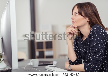 Thoughtful Office Lady Sitting at her Worktable and Leaning on her Elbow While Looking Up in a Deep Thinking Expression.
