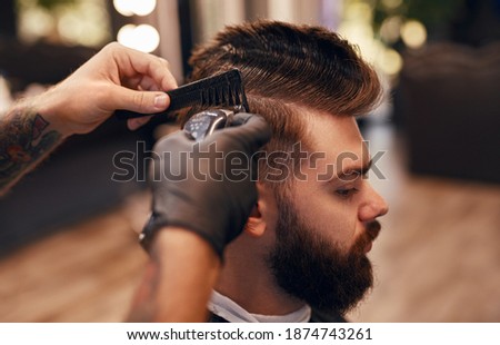 Similar – Image, Stock Photo Crop barber doing haircut for man