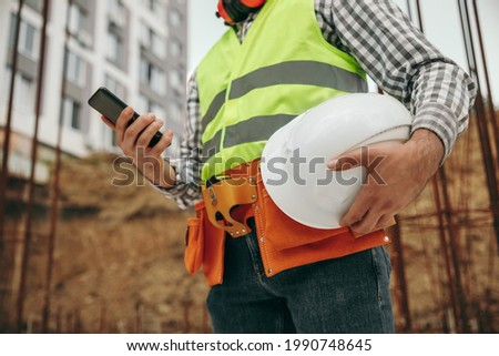 Image, Stock Photo Faceless male foreman using equipment at workshop