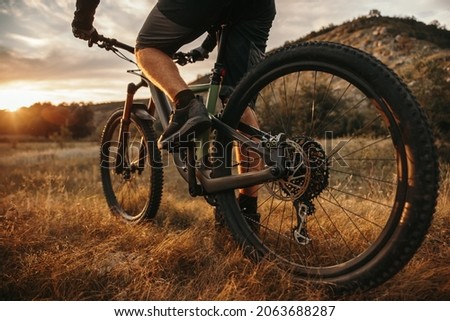 Similar – Image, Stock Photo Anonymous traveler on hill on misty day