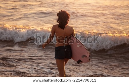 Similar – Image, Stock Photo Anonymous female surfer walking on beach with surfboard