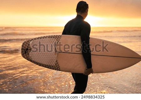 Similar – Image, Stock Photo Surfer standing at the beach with surfboard