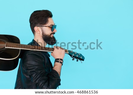 Similar – Image, Stock Photo Musician holding guitar at seaside