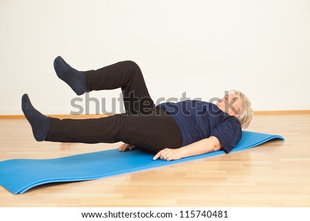pensioner woman doing exercise