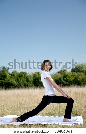 young woman to practice gymnastics in natural surroundings