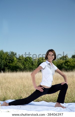young woman to practice gymnastics in natural surroundings