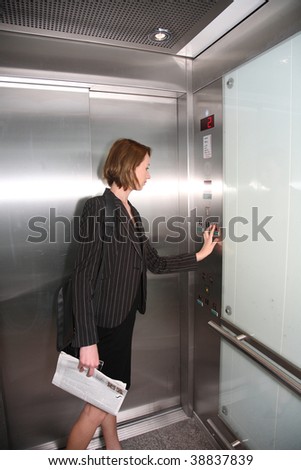 business woman in elevator