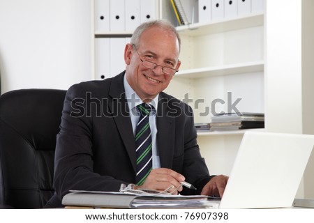 Old Business man with Laptop